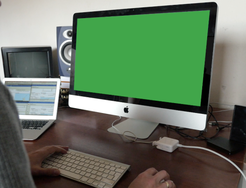 Man using computer with green display footage